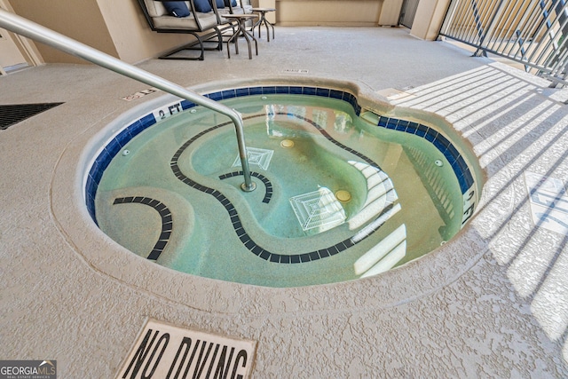 3481 Lakeside Dr NE Unit 2303, Atlanta, GA 30326 - view of pool featuring a pool, a hot tub, and a patio area