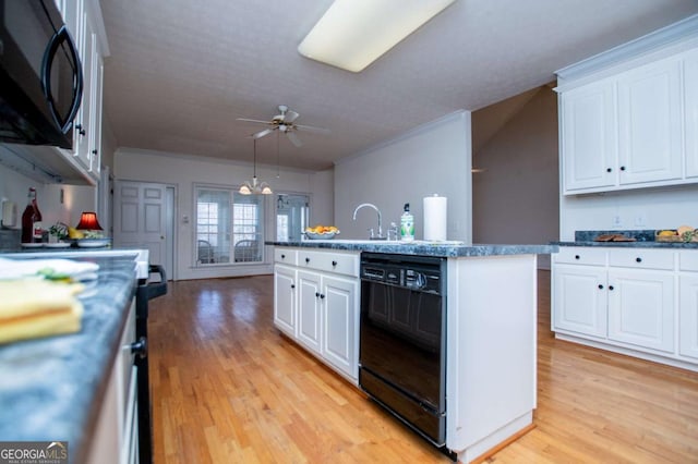 kitchen featuring light wood-type flooring, white cabinets, crown molding, and black appliances