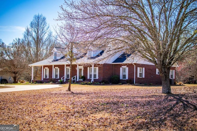 view of front of property featuring brick siding and crawl space