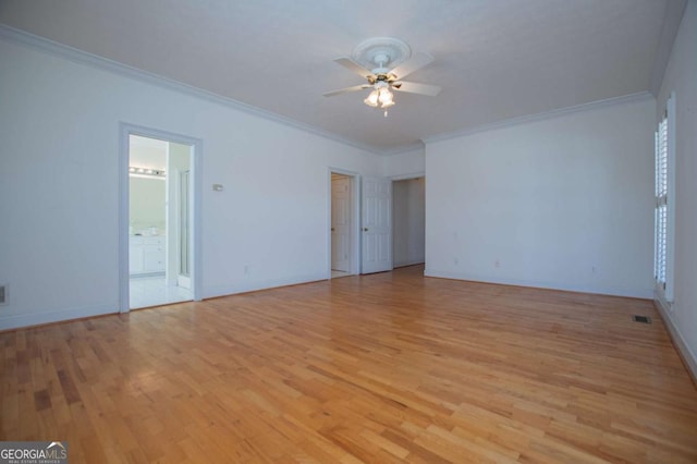 unfurnished room featuring light wood-style floors, crown molding, and a ceiling fan