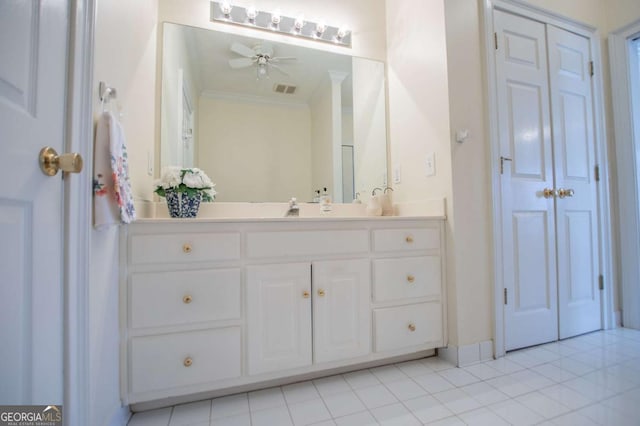 bathroom featuring visible vents, a ceiling fan, crown molding, and vanity