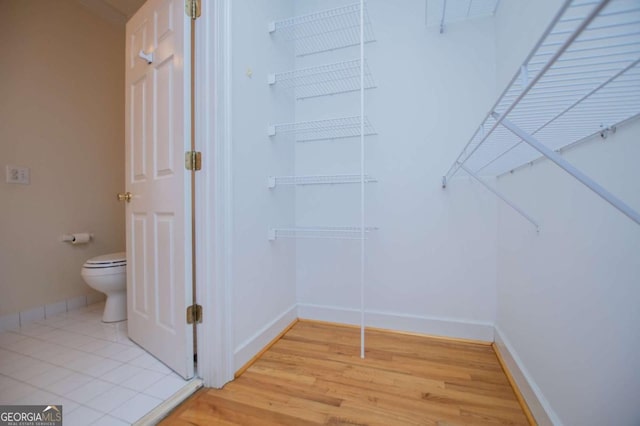 walk in closet featuring light wood-style floors