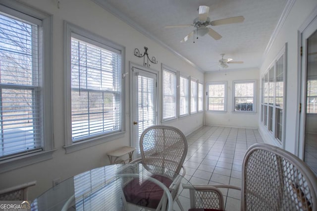 sunroom featuring ceiling fan and a healthy amount of sunlight