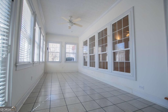 unfurnished sunroom with a ceiling fan