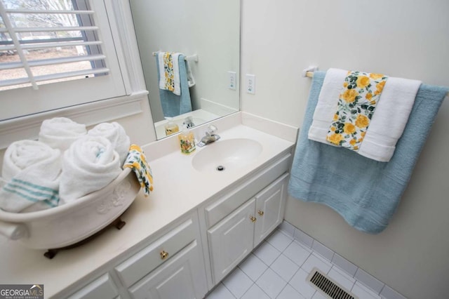 bathroom with vanity, visible vents, and tile patterned floors