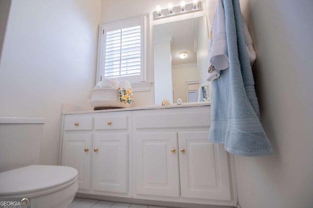 bathroom featuring toilet and vanity