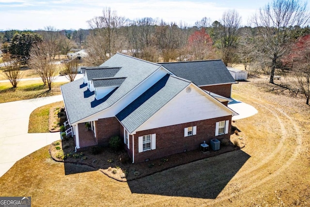 drone / aerial view featuring a view of trees