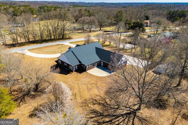 aerial view featuring a forest view