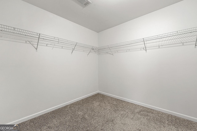 walk in closet with carpet flooring and visible vents