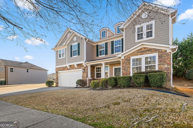 view of front facade with a garage, stone siding, and driveway
