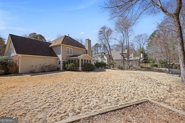 exterior space featuring a chimney