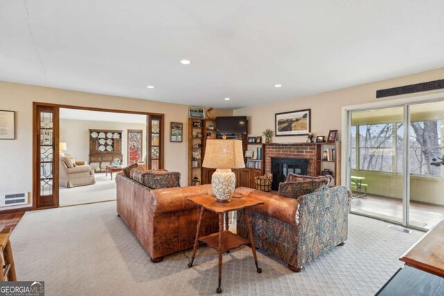 living area with carpet flooring, baseboards, and french doors