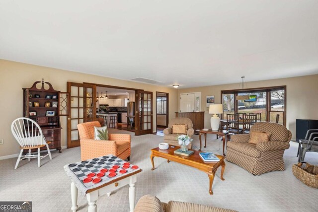 living room with baseboards and carpet floors