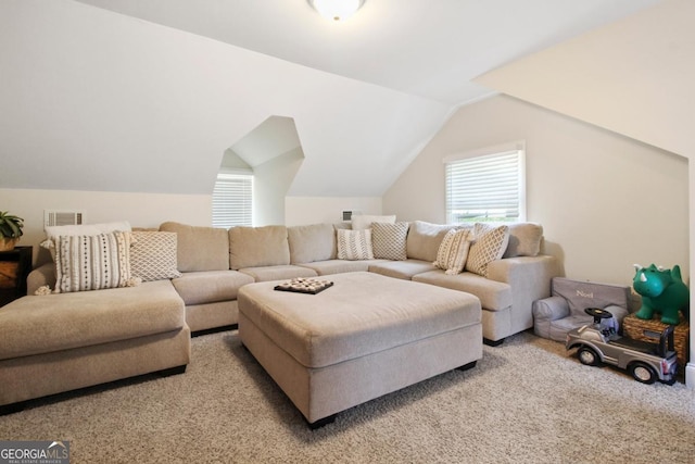 living area featuring light carpet, vaulted ceiling, and visible vents