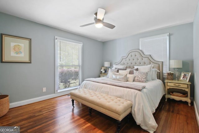 bedroom with a ceiling fan, baseboards, and wood finished floors