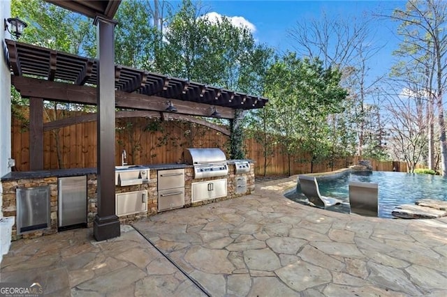 view of patio / terrace featuring a fenced backyard, a pergola, and area for grilling