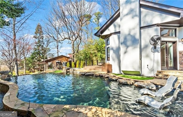 outdoor pool with french doors