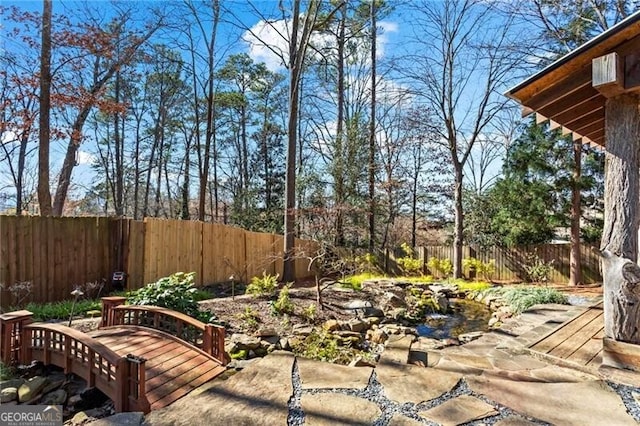 view of yard with a fenced backyard