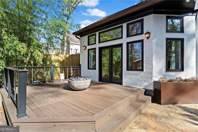 wooden deck with french doors and fence