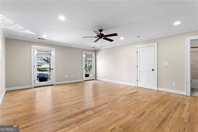 unfurnished living room with light wood-style floors, recessed lighting, ornamental molding, and baseboards