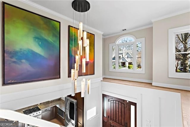 room details featuring ornamental molding and visible vents