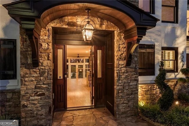 view of exterior entry with stone siding