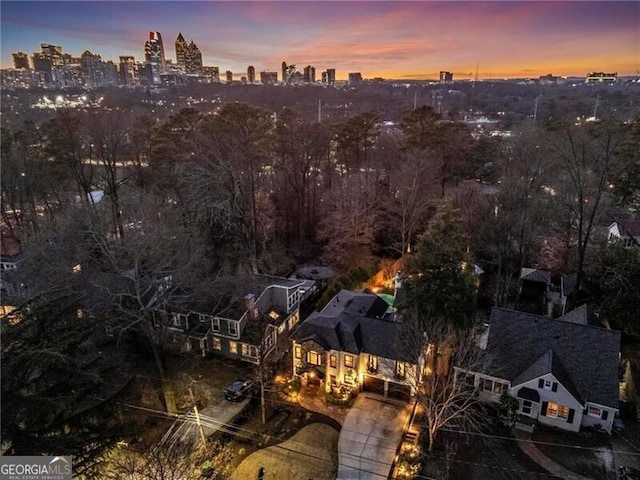 birds eye view of property with a view of city