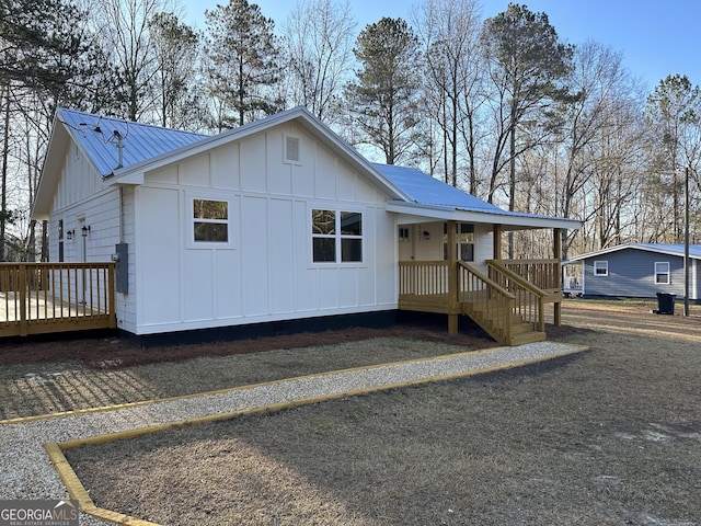 view of front of home featuring metal roof and board and batten siding