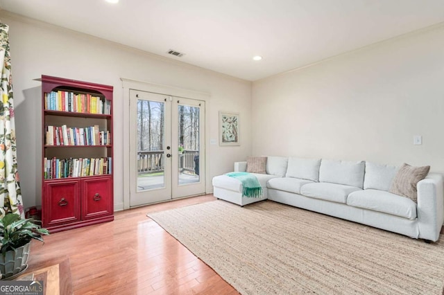 living room featuring french doors, wood finished floors, visible vents, and recessed lighting