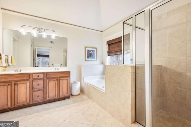 bathroom featuring a garden tub, a sink, visible vents, tile patterned floors, and a stall shower