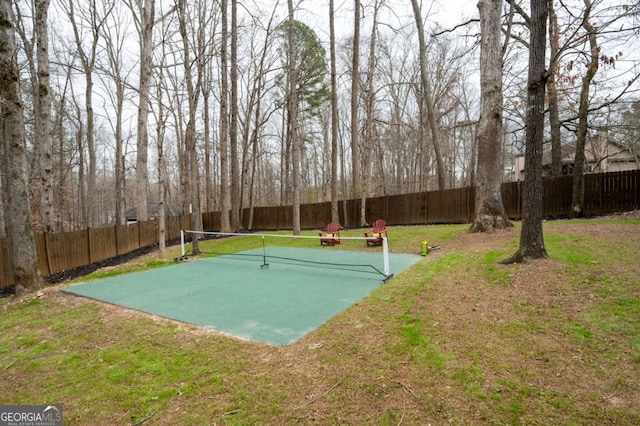 view of home's community with a yard and a fenced backyard