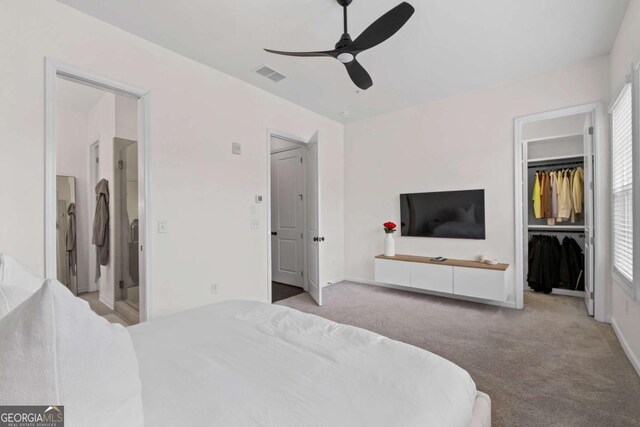 bedroom featuring baseboards, ceiling fan, visible vents, and carpet flooring