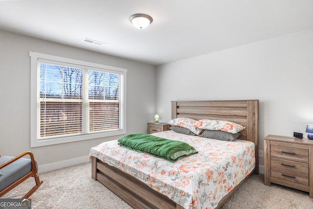 bedroom featuring carpet floors, baseboards, and visible vents