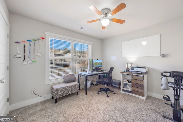 home office with ceiling fan, carpet floors, visible vents, and baseboards