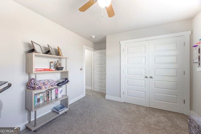 carpeted bedroom featuring ceiling fan, baseboards, and a closet