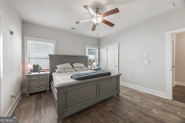 bedroom featuring dark wood-style floors and visible vents