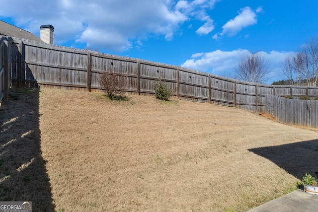 view of yard featuring a fenced backyard