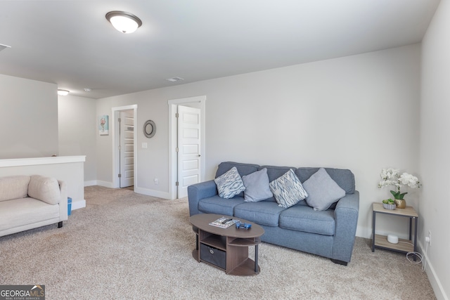 living room with baseboards and carpet flooring