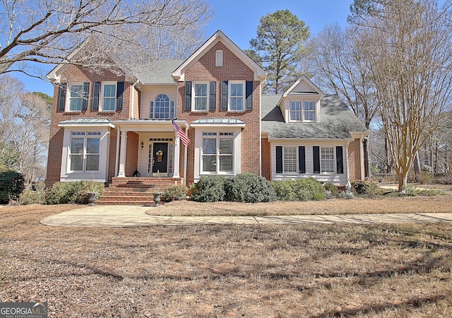 traditional-style house with brick siding