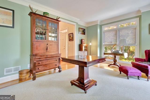 home office featuring ornamental molding, carpet, visible vents, and baseboards