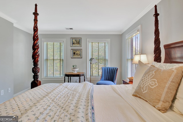 bedroom with ornamental molding and visible vents