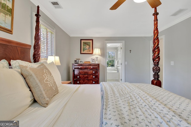 bedroom with visible vents, crown molding, and ensuite bathroom