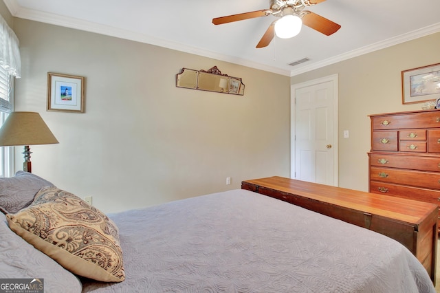 bedroom with ceiling fan, visible vents, and ornamental molding