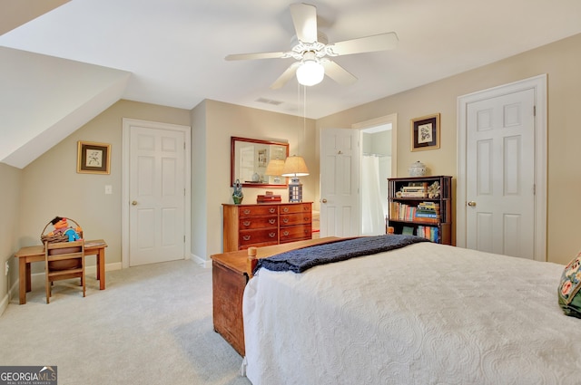 bedroom featuring baseboards, visible vents, a ceiling fan, and light colored carpet