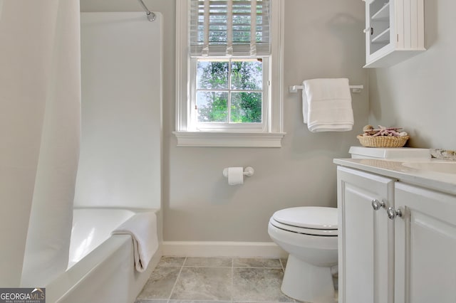 bathroom featuring baseboards, toilet, shower / tub combination, tile patterned flooring, and vanity