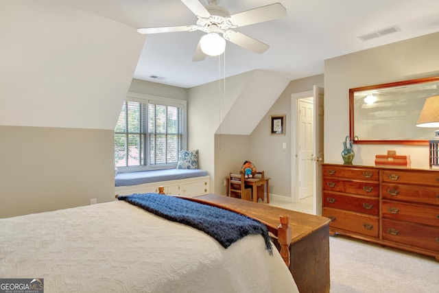 bedroom with light carpet, lofted ceiling, visible vents, and a ceiling fan