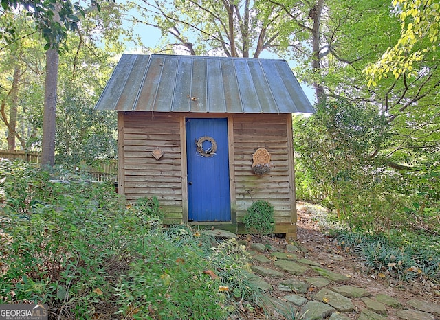 view of shed with fence