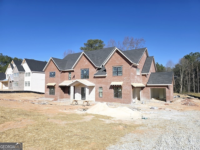 view of front of house featuring brick siding