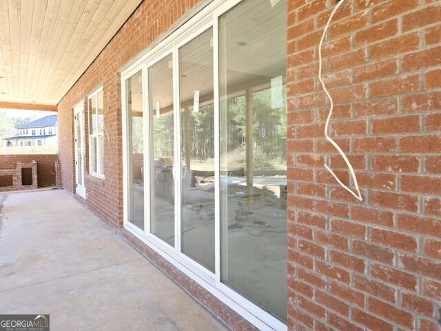 doorway to property with stone siding