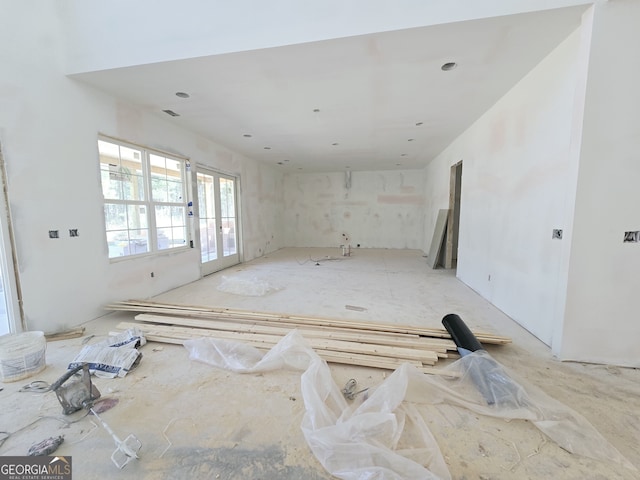 unfurnished room featuring french doors